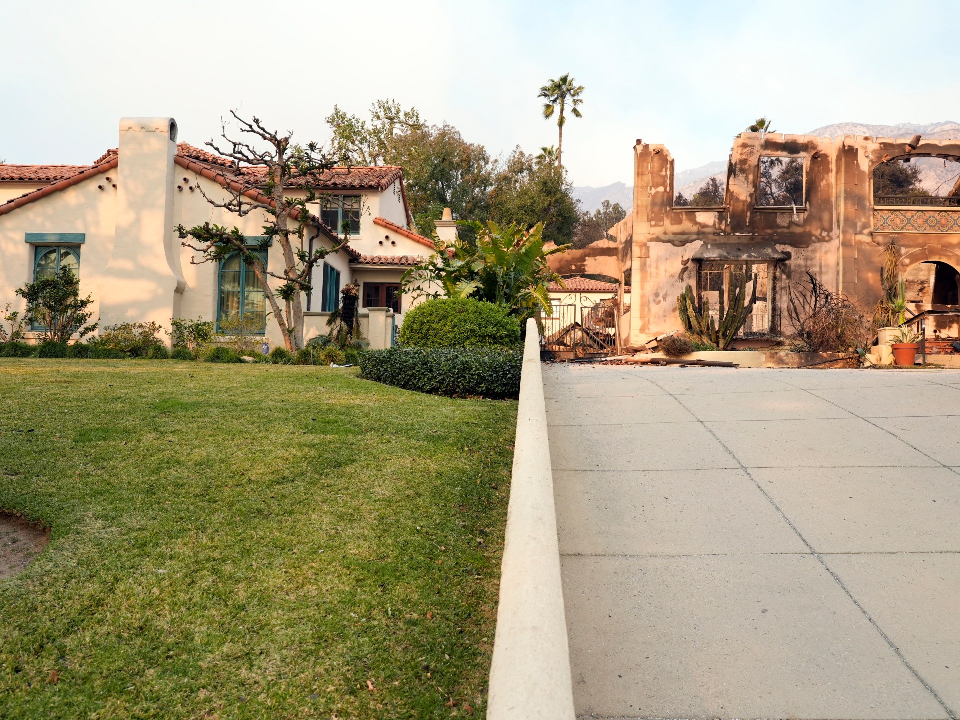 In scorched neighbourhoods, a few Los Angeles homes stand untouched | Climate News