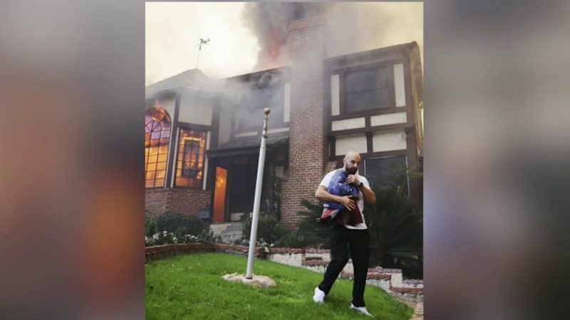 Russian man saves American flag outside burning home in Altadena, CA